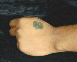 Coin thru the Hand (brass)